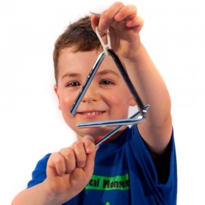 Musical Monsters pupil playing the triangle